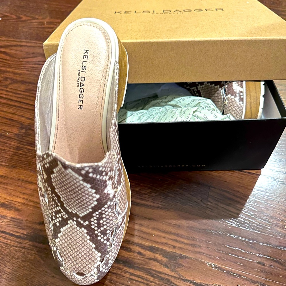 Kelsi Dagger platform shoes with snake print, and wood heels. 8.5M